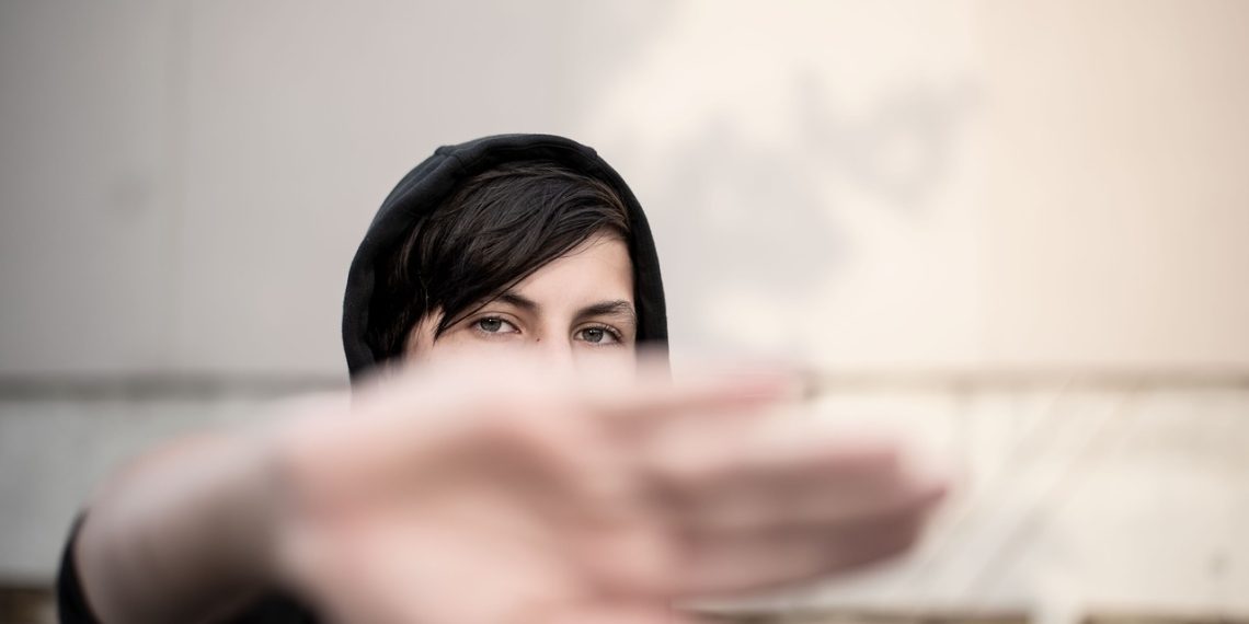 teenager, hoodie, hand